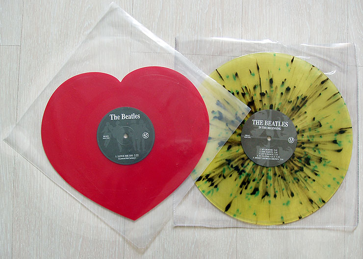 The Beatles red colored heart shaped 12 inch single Love Me Do and splattered colored LP IN THE BEGINNING by Mischief Music company