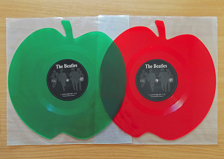 The Beatles Green and red colored apple shaped 12 inch singles Love Me Do / P.S. I Love You from Mischief Music